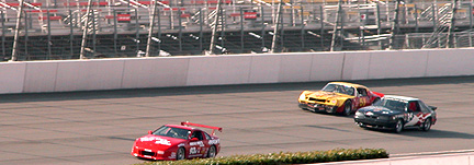 Entering turn one in front of Camaro & Mustang.