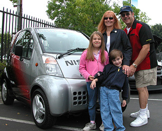 Family with electric car.