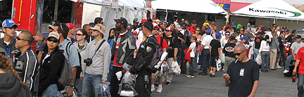 People lining up on midway.