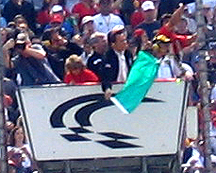 Arnold throws green flag.