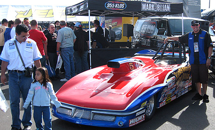 Wide shot of Travis, the Vette & KLOS booth.