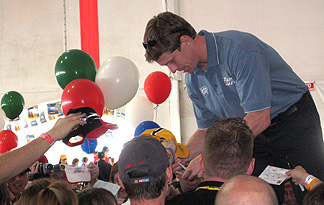 Carl Edwards signs autographs.