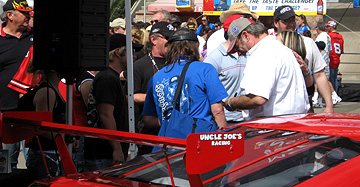 Unc signs autographs at Z car.