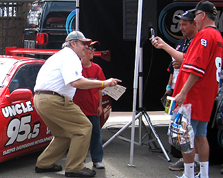 Unc signs autographs at Z car.