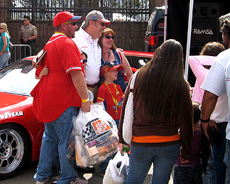 Unc signs autographs at Z car.