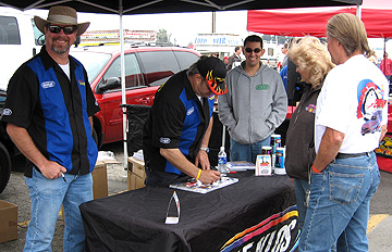 Randy grinning at the booth.