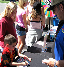 Adam signing a card for Joe.