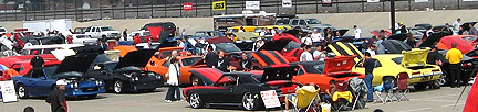 Wide shot of car show.