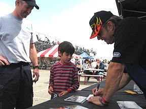 Talking with a kid & his dad.