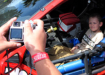 Taking a picture of his son.