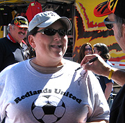 Signing her shirt.