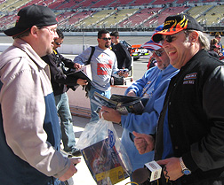 Meeting fans in pit lane.