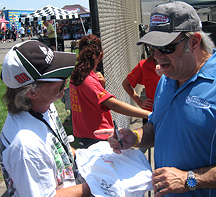 Signing shirts.