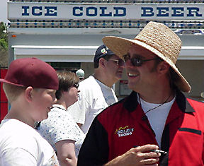 Joe & kid compare hats.