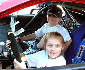 Kids in the race car.