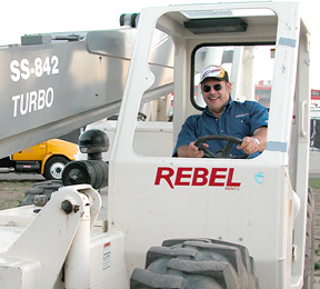 J.B. driving his crane.